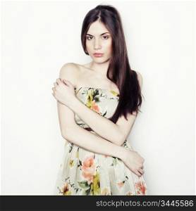 Fashion portrait of young beautiful elegant woman with dark hair. Close-up