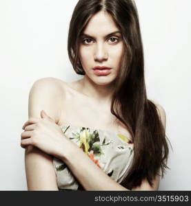 Fashion portrait of young beautiful elegant woman with dark hair. Close-up