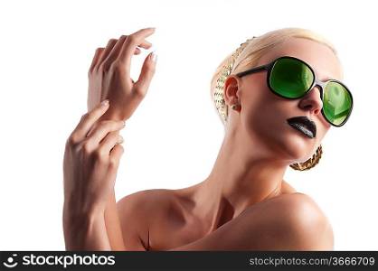 fashion portrait of young blond woman with hair style black lips and wearing green sunglasses over white