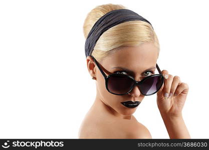 fashion portrait of young blond woman with hair style black lips and wearing sunglasses posing against white background