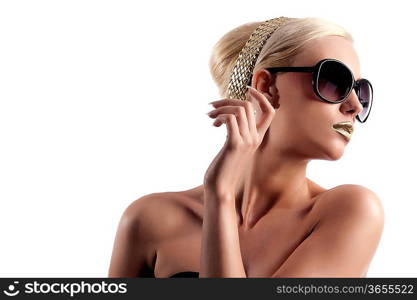 fashion portrait of young blond woman with hair style gold lips looking in one side with sun glasses