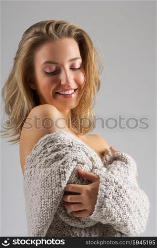 Fashion portrait of young girl on grey background