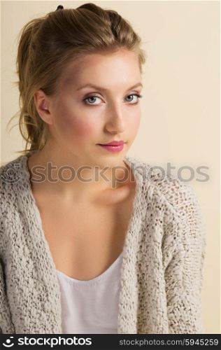 Fashion portrait of young girl on yellow background