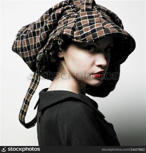 Fashion portrait of young lady with hat