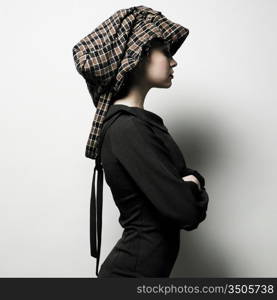 Fashion portrait of young lady with hat