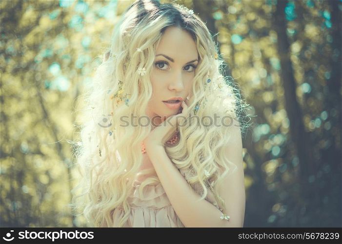 Fashion portrait of young pretty woman in summer sunny day