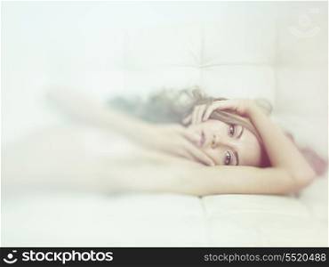 Fashion portrait of young sensual woman in bed