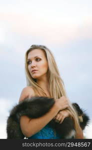 Fashion portrait of young sensual woman in garden