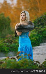 Fashion portrait of young sensual woman in garden