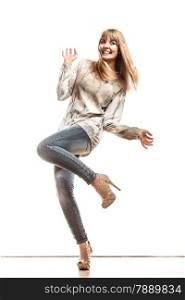 Fashion. Positive blonde fashionable woman jeans pants bright sleeve shirt. Female model posing isolated studio shot