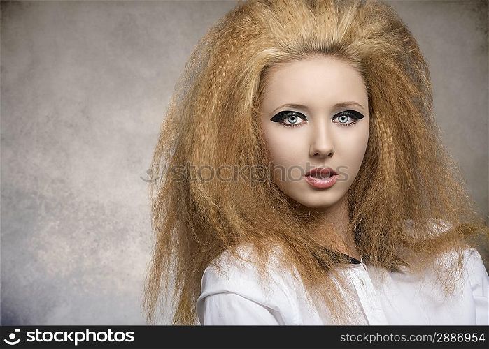 fashion pretty rock girl with dark glossy make-up, creative hair-style in close-up portrait on grunge background