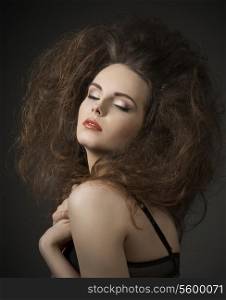 fashion sexy lady in romantic pose with black bra and volume creative hair-style