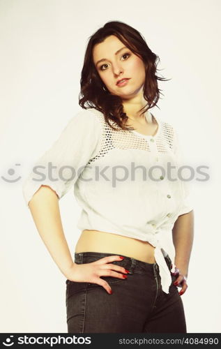 Fashion. Sexy plus size woman in casual clothes, posing studio shot