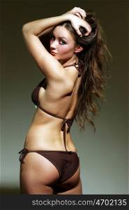 Fashion shot of a beautiful, sexy, brunette woman in Brown lingerie &#xA;
