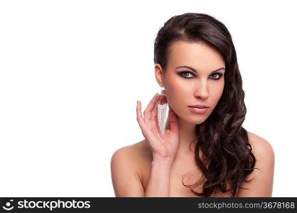 fashion shot of a cute young brunette with long hair and naked shoulder isolated on white background