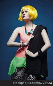 Fashion shot of a woman in a yellow wig and colorful clothes