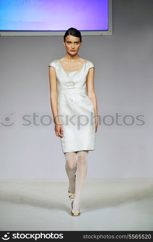 fashion show event and beautiful young woman at piste walking in luxury dress