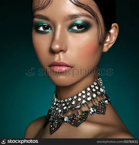 Fashion studio portrait of beautiful asian woman with diamond necklace. Fashion and Beauty. Perfect makeup