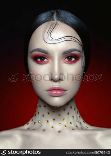 Fashion studio portrait of beautiful woman with bright red makeup. Fashion and Beauty. Perfect makeup
