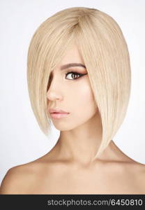 Fashion studio portrait of lovely asian woman with blonde short hair. Fashion and beauty. Bright makeup. Fashionable haircut