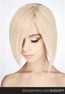 Fashion studio portrait of lovely asian woman with blonde short hair. Fashion and beauty. Bright makeup. Fashionable haircut