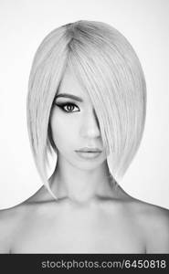 Fashion studio portrait of lovely asian woman with blonde short hair. Fashion and beauty. Bright makeup. Fashionable haircut