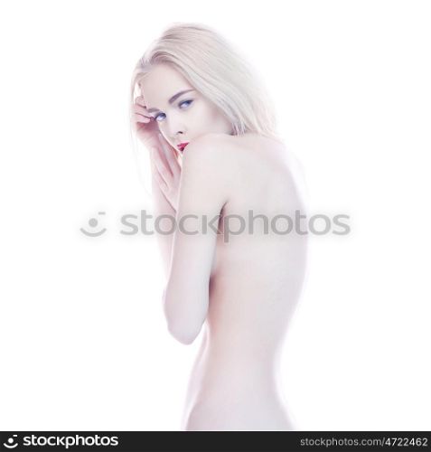 Fashion studio portrait of nude elegant blonde on white background