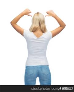 fashion, style, advertisement and people concept - rear view of young woman in blank white t-shirt