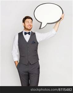 fashion, style and communication concept - happy man in suit holding blank text bubble banner. happy man in suit holding blank text bubble banner. happy man in suit holding blank text bubble banner