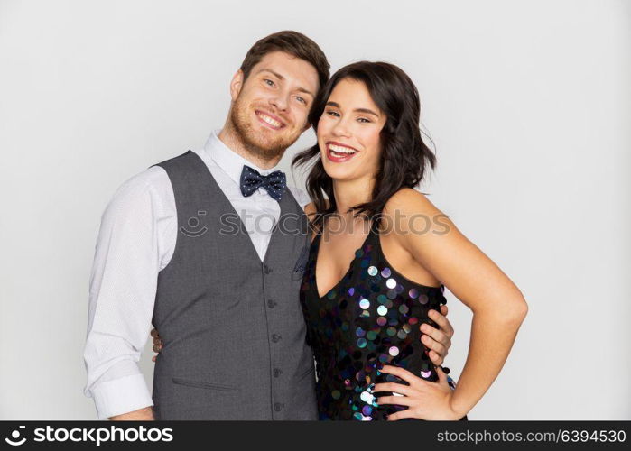 fashion, style and holidays concept - happy couple hugging at party. happy couple hugging at party