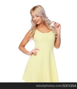 fashion, style and people concept - happy smiling beautiful young woman posing in yellow dress. happy smiling beautiful young woman in dress