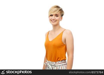 fashion, style and people concept - happy smiling young woman over white background. happy smiling young woman over white background