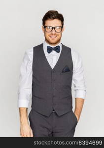 fashion, style and vintage concept - happy man in festive suit and eyeglasses. happy man in festive suit and eyeglasses