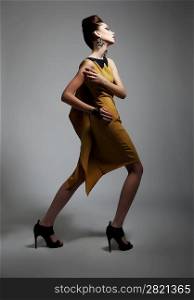 Fashion style - beauty artistic woman in contemporary dress posing. Series of photos
