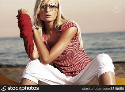 Fashion style photo of an attractive woman in sunglasses
