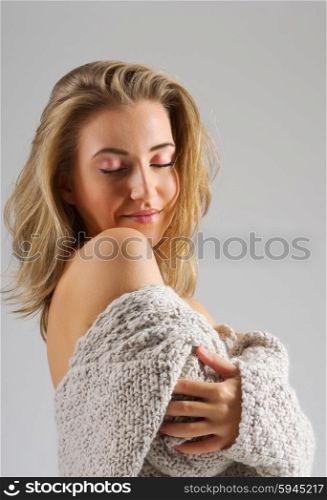 Fashion style portrait of young girl on grey background