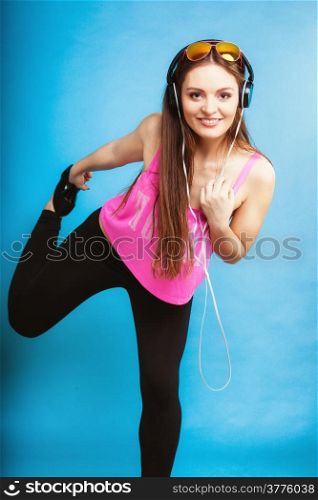 Fashion teen girl headphones listen music mp3 player, Fresh energetic young woman relax happy and dancing blue background