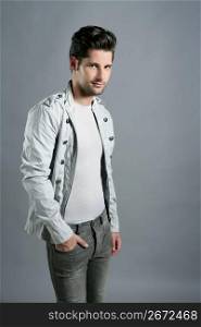 Fashion trendy young man silver portrait over gray