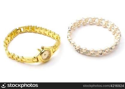 Fashion watch and bracelet closeup on white background