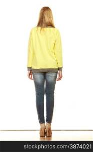 Fashion. Woman full length in denim trousers high heels shoes yellow blank blouse back view isolated on white