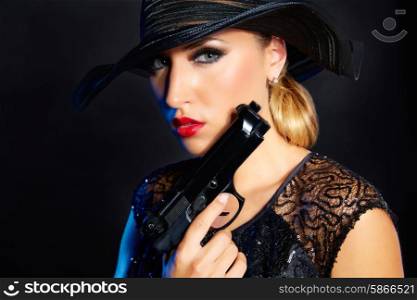 Fashion woman gangster style with handgun pistol on black background