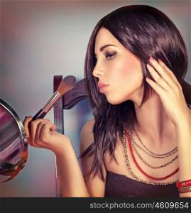 Fashion woman portrait, attractive girl looking in the mirror and doing stylish makeup, preparation to party, gorgeous fashionable look