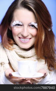 Fashion woman stylish winter makeup holding cup of latte coffee hot drink time for enjoyment blue background