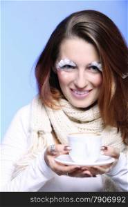 Fashion woman stylish winter makeup holding cup of latte coffee hot drink time for enjoyment blue background
