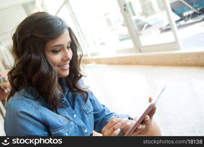 Fashion woman using tablet with lens flare