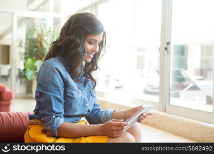 Fashion woman using tablet with lens flare