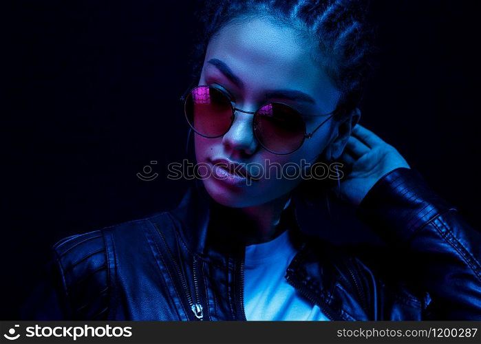 Fashion young african girl black woman wear stylish pink glasses looking at camera isolated on black studio background, horizontal banner for website design, portrait, copy space