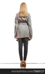 Fashion. Young blonde fashionable woman in elegant gray belt coat. Female model in full body rear view isolated on white