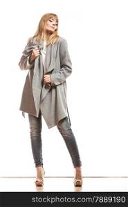 Fashion. Young blonde fashionable woman in elegant gray belt coat. Female model posing isolated on white background