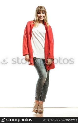 Fashion. Young blonde fashionable woman in full body wearing vivid color red wool coat high heels shoes. Female model posing isolated on white